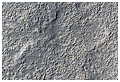 Tilted Layers on Edge of Northern Mid-Latitude Crater