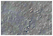 Chains of Pits on Southwest Edge of Tharsis Region