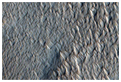 Mesa Scarp and Ridged Layered Material