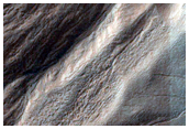 Gullies Incising Mantle-Filled Alcove in Eastern Argyre Region
