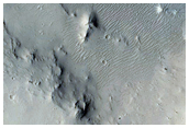 Layering in Crater Walls in Tartarus Colles