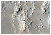 Crater in Central Arabia Terra with Yardangs at Northeast Wall