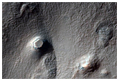 Deformed Crater with Ice-Rich Mantle Fill