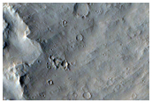 Layers in Pedestal Crater Near Eumenides Dorsum