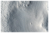 Central Mound and Arcuate Ridges in Mid-Latitude Crater