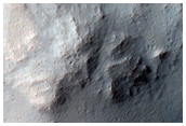 Well-Preserved Impact Crater on Floor of Larger Infilled Crater