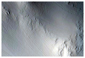 Layers in Crater West of Tikhonravov Crater
