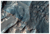 Light-Toned Deposits Exposed along Floor of Terra Sabaea Crater