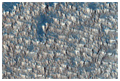 Low Thermal Inertia Material in Syria Planum