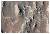Dunes and Light-Toned Bedrock in Crater East of Briault Crater