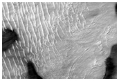 Depression in Hellas Planitia with Dark Spots