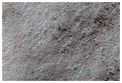 Spot Development Influenced by Underlying Terrain in Crater