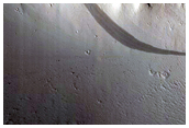 Crater with Fans and Sinuous Ridges Near Distal Marte Vallis