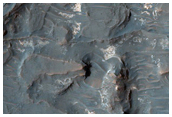Light-Toned Deposits Exposed along Floor of Terra Sabaea Crater