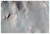 Channel and Mesa-Forming Material on West Wall of Elorza Crater