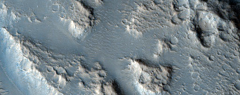 Hebrus Valles Collapse and Raised Features