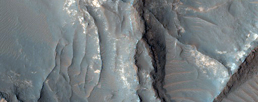 Light-Toned Deposits Exposed along Floor of Terra Sabaea Crater