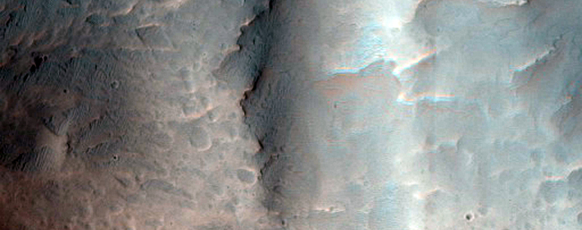 Fan Shaped Landforms at Valley Termini in Crater