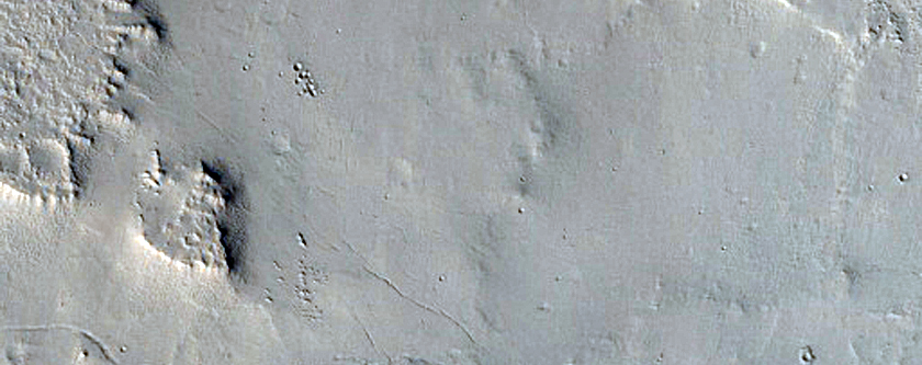 Cratered Mesa-Forming Material at Entrance of Valley into Depression