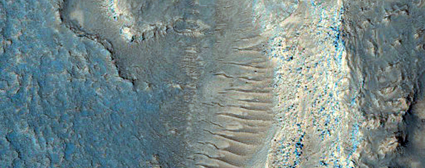 Possible Pitted Flow Emanating from Oudemans Crater