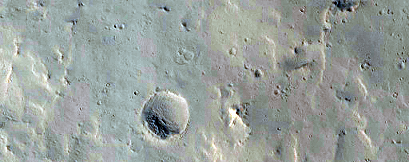 Secondary Crater Chain Scours North of Highly Collapsed Complex Crater