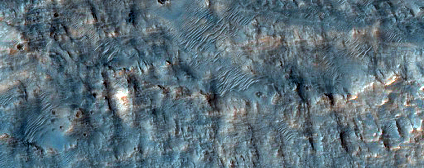 Possible Phyllosilicate in Crater Ejecta Northwest of Hellas Planitia