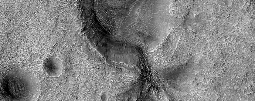 Crater with Breached Rim and Interior Terraced Landform