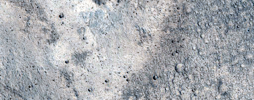 Pasted-on Material on Crater Ejecta
