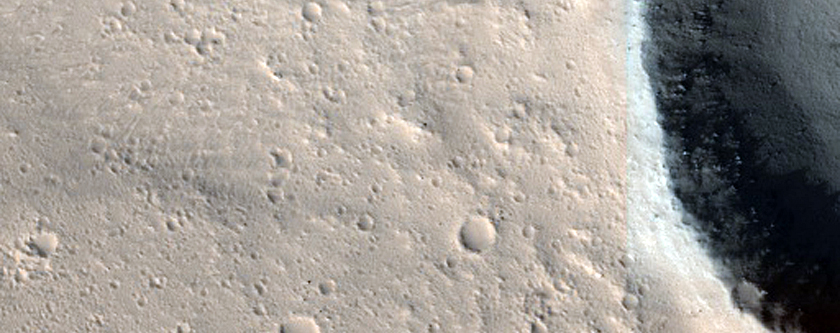 Crater in Flow Region in Olympus Mons Aureole