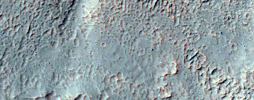 Monitor Slopes of Well-Preserved Crater in Aonia Terra