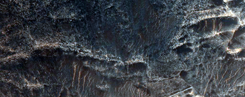 Contact between Light-Toned Deposits and Northern Melas Chasma Wallrock