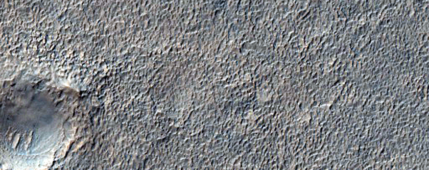 Fresh Shallow Valley and Fan Deposit in Crater