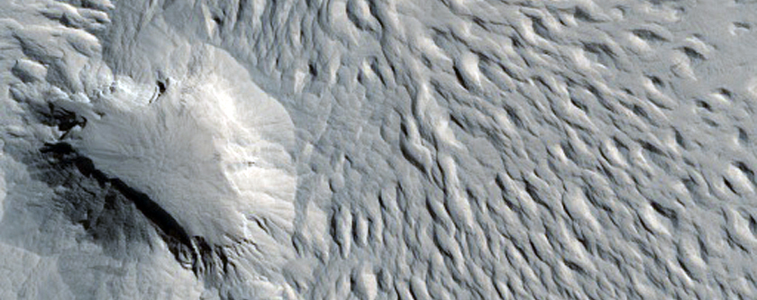 Yardangs and Pits in Valley in Lycus Sulci