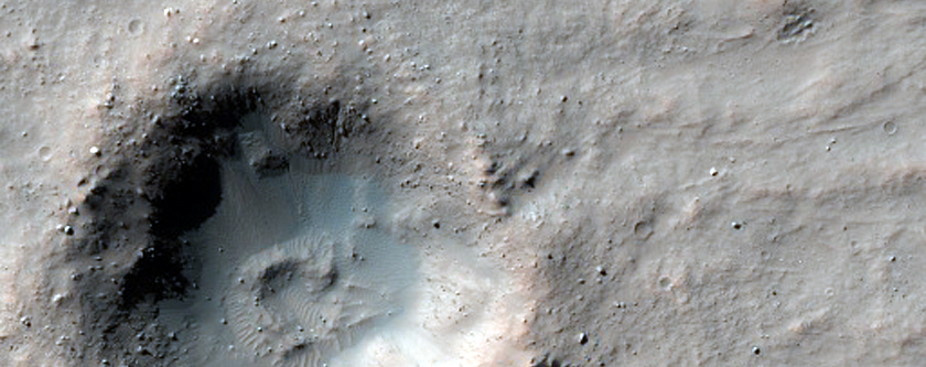 Crater with Dark Night-Infrared Ejecta Blanket in Daedalia Planum
