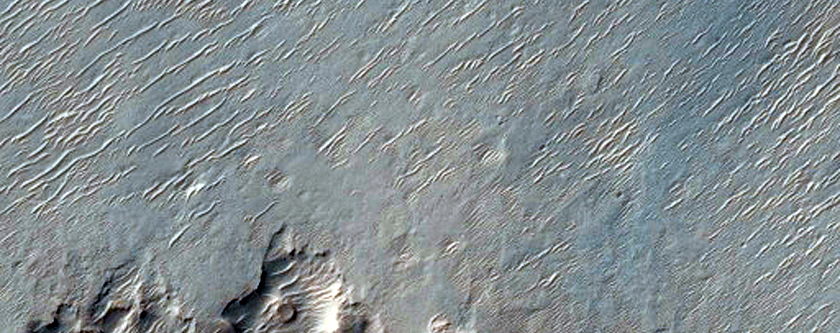 Light-Toned Material in Pit in Loto Crater
