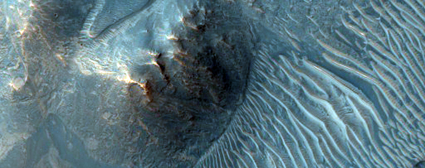 Light-Toned Exposures of Materials within Noctis Labyrinthus