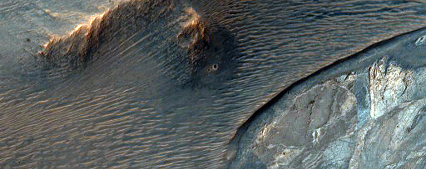 Light-Toned Materials Exposed within Noctis Labyrinthus Hills