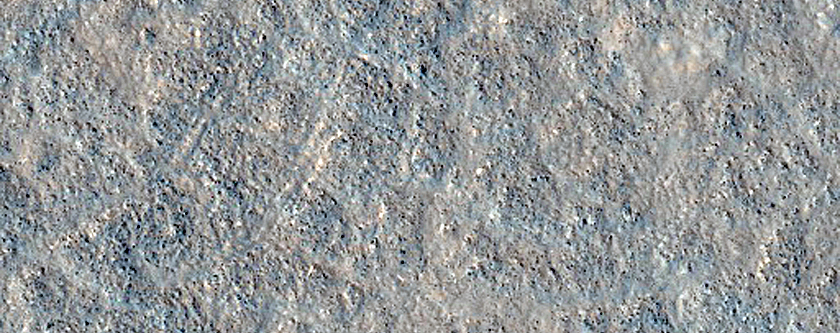 Small Crater with Ejecta Entering Larger Adjacent Crater