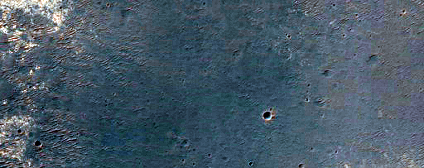 Light-Toned Layered Material along Ius Chasma Plateau