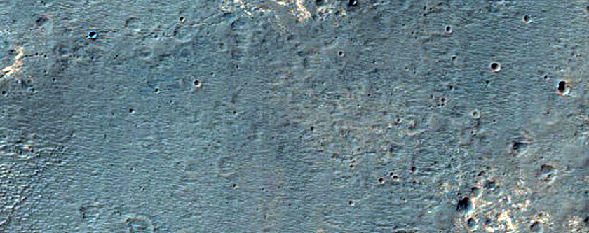 Light-Toned Layered Deposits along Ius Chasma Plateau
