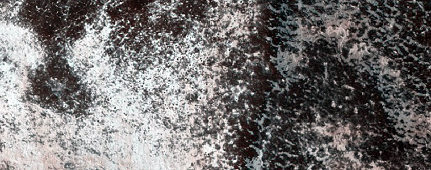 Persistent Northern Plains Ice Deposit Monitoring on Louth Crater Rim
