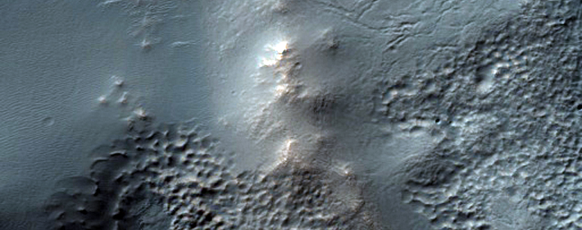 Channel and Trough Interaction North of Warrego Valles
