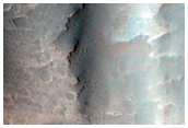 Fan Shaped Landforms at Valley Termini in Crater