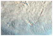 Relationship of Curvilinear Channel and Crater Ejecta