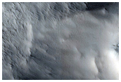 Crater Near Possible Omega Olivine Detection