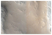 Central Peak of Crater at Edge of Pettit Crater Ejecta