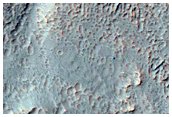 Monitor Slopes of Well-Preserved Crater in Aonia Terra
