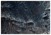 Contact between Light-Toned Deposits and Northern Melas Chasma Wallrock
