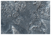 Pitted and Terraced Landform in Crater in Themis V17696009
