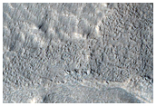 Possible Tongue-Shaped Flow Features in Deuteronilus Mensae
